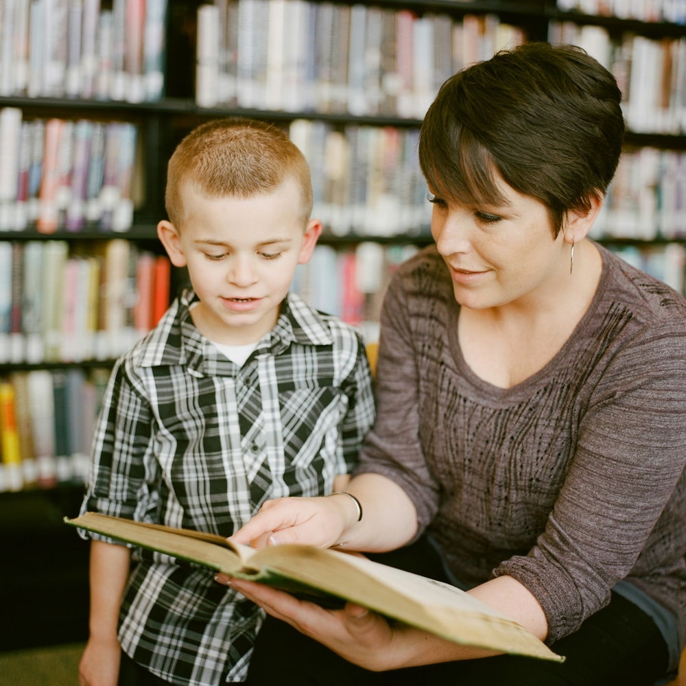 A teacher reads to a child